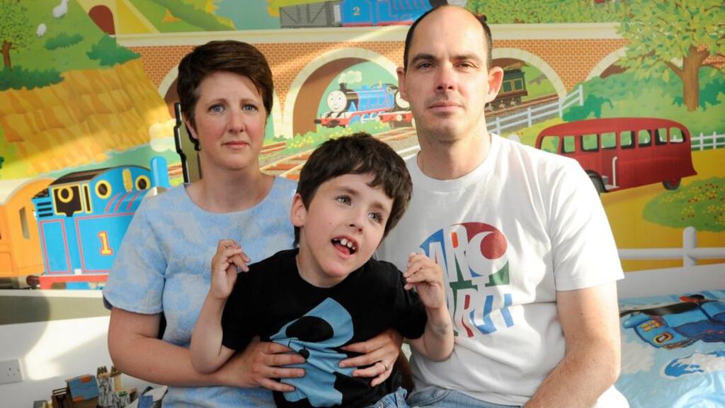 Alicia Liebenberg, her husband Karel, and their son Finn, who has cerebral palsy. “It’s hard for parents like me to keep fighting every battle,” said Ms Liebenberg. Photograph: Dave Meehan