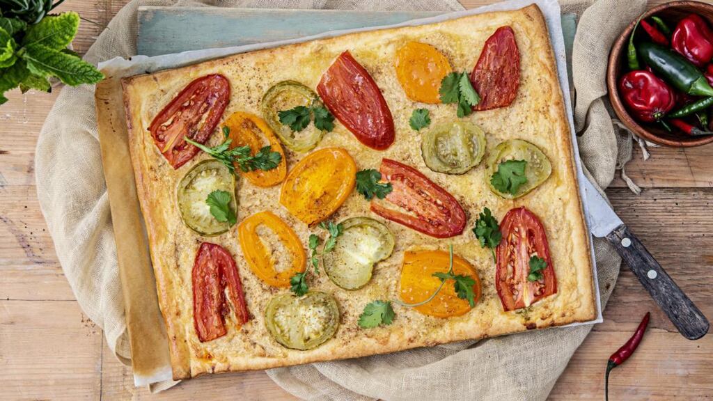 Spiced tomato tart with hummus and corriander. Photograph: Harry Weir