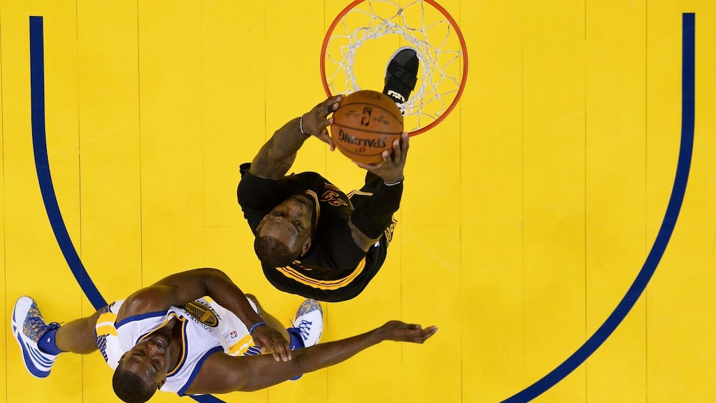 Cleveland Cavaliers forward LeBron James dunks the ball as Golden State Warriors forward Harrison Barnes defends during the NBA Finals game five at the Oracle Arena in Oakland, California. Photograph: EPA/John G Mabanglo