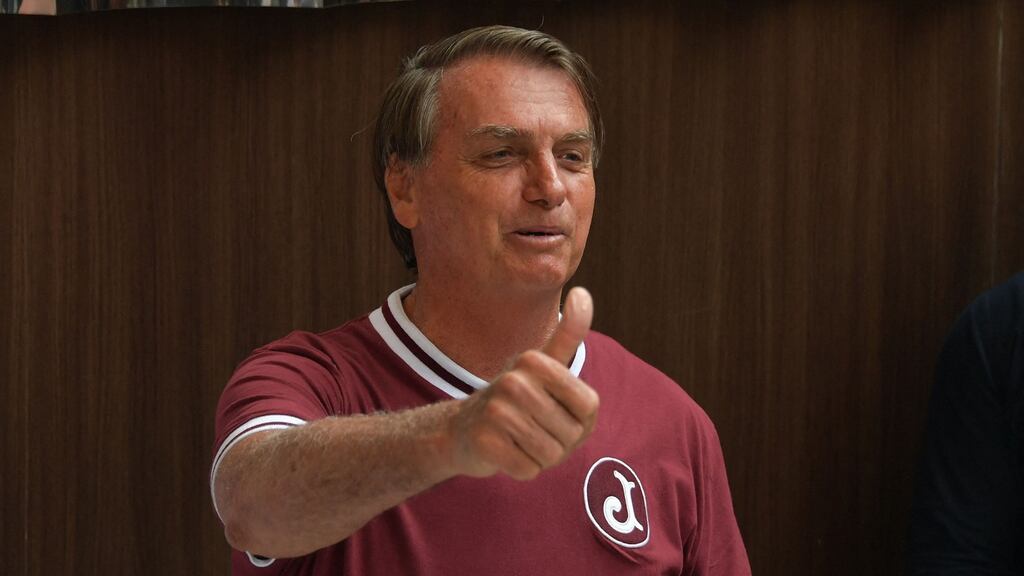 Brazil’s president Jair Bolsonaro: he says the new variant is far less lethal and ‘could signal the end of the pandemic’. Photograph: by Nelson Almeida/AFP