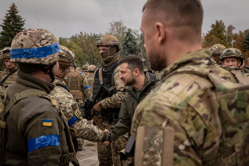 President Volodymyr Zelensky with Ukrainian solddiers. Photograph: Nicole Tung/The New York Times