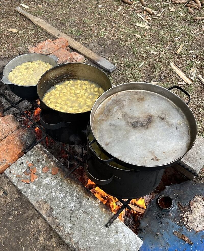Eugene Kolychev’s parents sent a photograph showing how they had to prepare food over a fire in the street because relentless Russian bombing had left Chernihiv without gas, water or heating