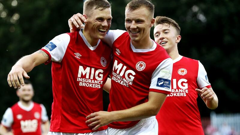 Ian Turner celebrates scoring a goal with his St patrick’s Athletic team-mates Jamie Lennon and Darragh Markey during the SSE Airtricity League Premier Division match at Richmond Park. Photograph: Bryan Keane/Inpho