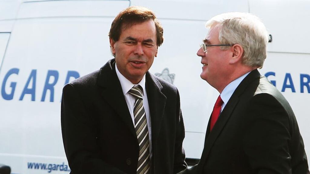 Justice Minster Alan Shatter with Tanaiste Eamon Gilmore at the funeral mass of Fine Gael TD Nicky McFadden, in Athlone yesterday. All documentation and equipment linked to the recording of Garda calls is under review within the force. Photograph: PA