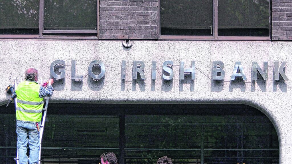 Anglo Irish Bank signage and lettering being removed from the bank’s headquarters Office in St Stephen’s Green, Dublin. File photograph: Bryan O’Brien/The Irish Times