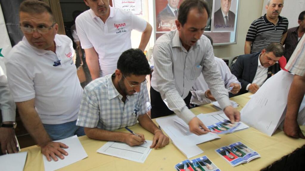 Staff coun votes of the three candidates in the Syrian presidential elections following closure of the polls in Damascus, Syria, early today. Phootgraph: Youssef Badawi/EPA