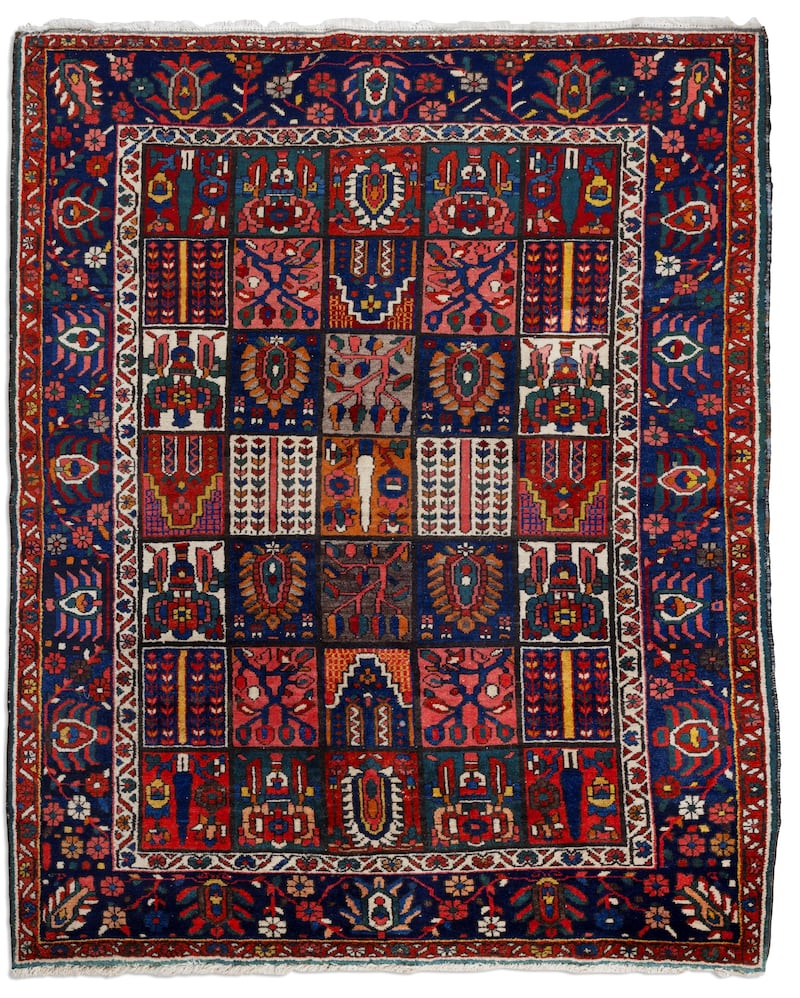 A wool rug made by the Bakhtiari people in Iran (€600-€800) at Adam's Country House Collections auction