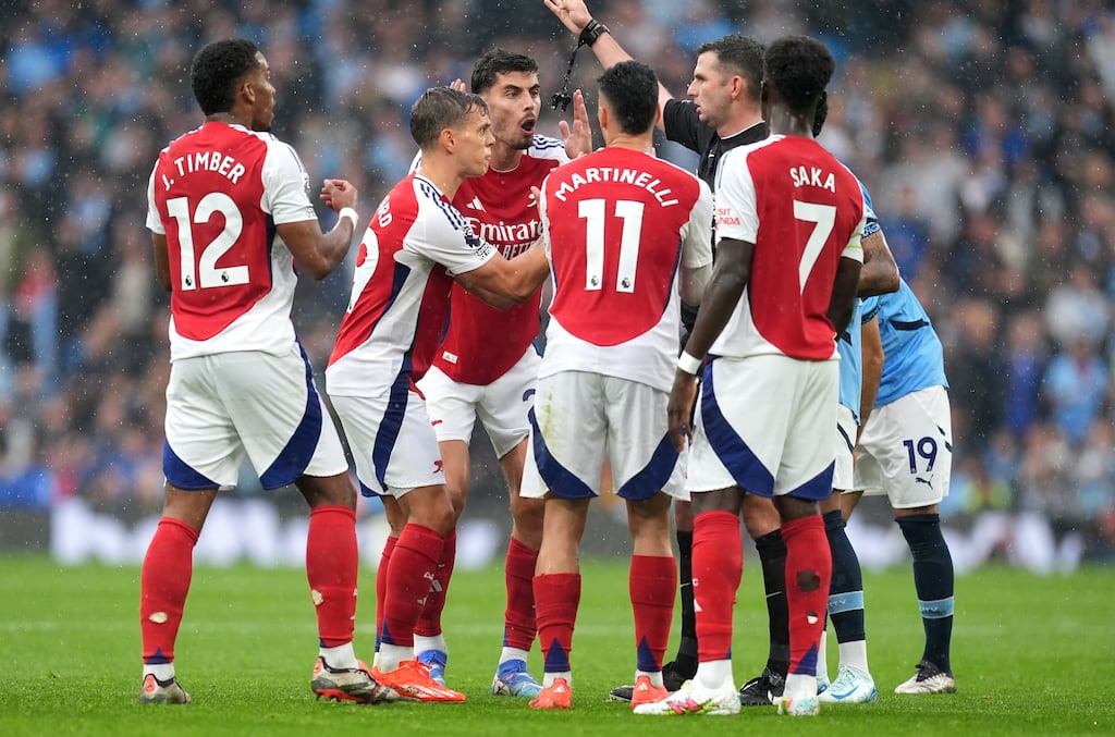 Arsenal's Leandro Trossard, second left, is shown a red card by referee Michael Oliver during the Premier League clash against Manchester City at the Etihad Stadium. Photograph: Martin Rickett/PA Wire