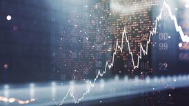 Shares nudge higher in Europe after Fed hikes rate