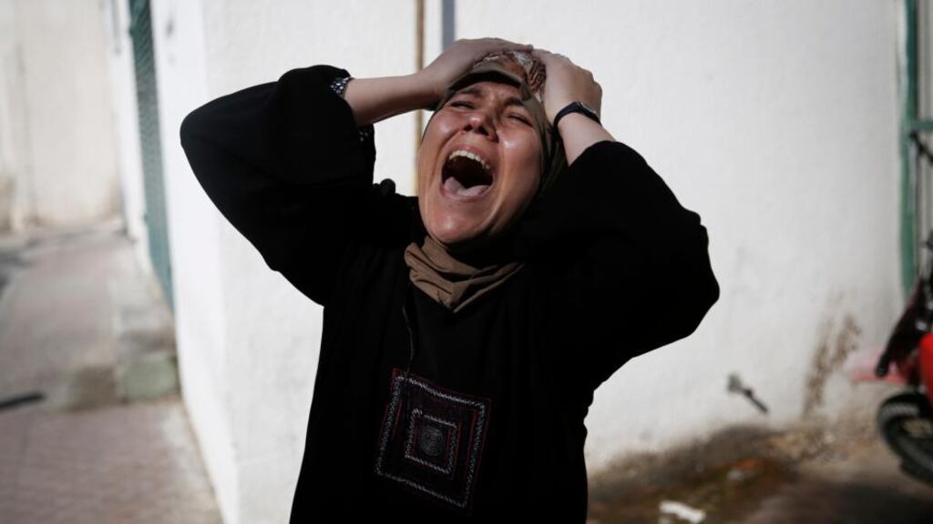 The mother of one of the four Palestinian children from the Bakr family, whom medics said were killed by a shell fired by an Israeli naval gunboat, grieves outside the morgue in Gaza City. Photograph: Finbarr O’Reilly/Reuters