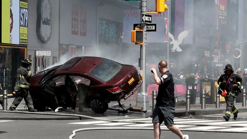 A vehicle that struck pedestrians and later crashed is seen on the sidewalk in Times Square in New York City, US. Photograph: Mike Segar/Reuters