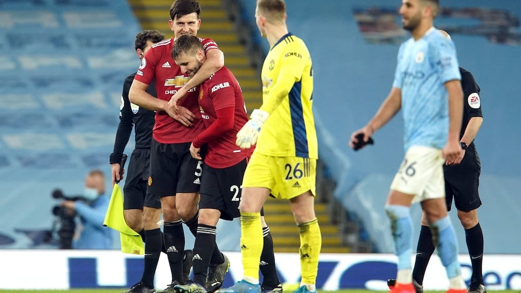 Manchester United’s Harry Maguire congratulates Luke Shaw after their win over Manchester City. Photo: Dave Thompson/PA Wire