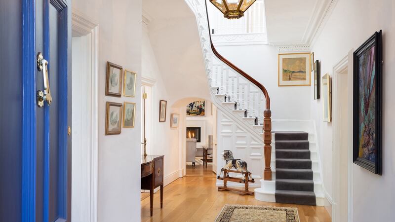 An elegant original staircase stands to the rear of the large entrance hall