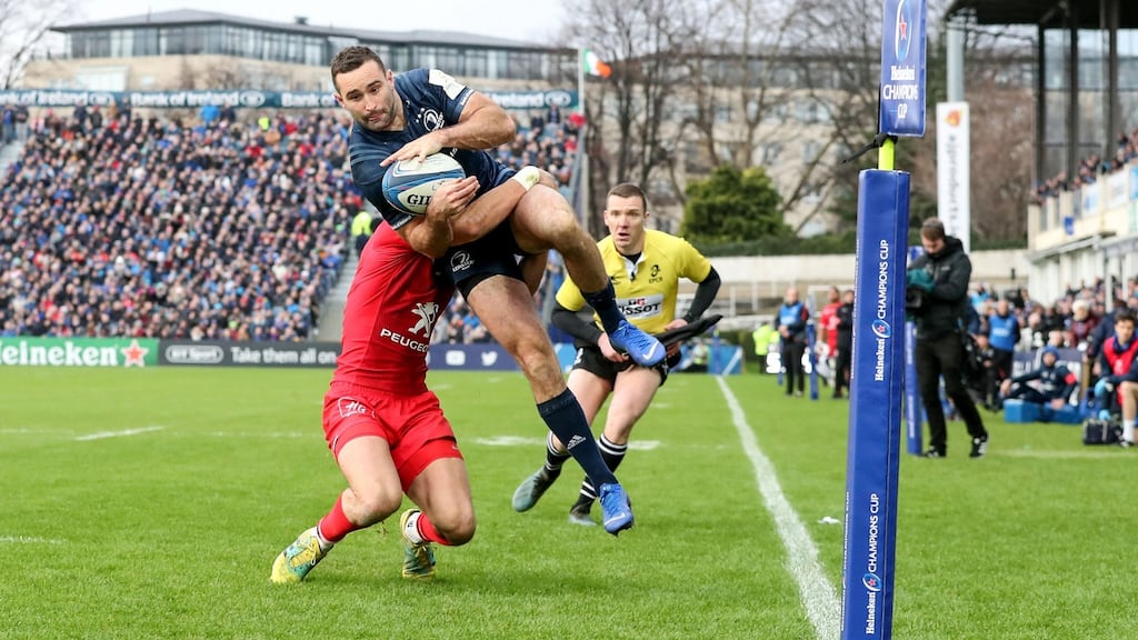 Leinster’s Dave Kearney fields Ross Byrne’s crossfield kick to score a try desptie the attempted tackle from Toulouse’s Romain Ntamack at the RDS. Photograph: Dan Sheridan/Inpho