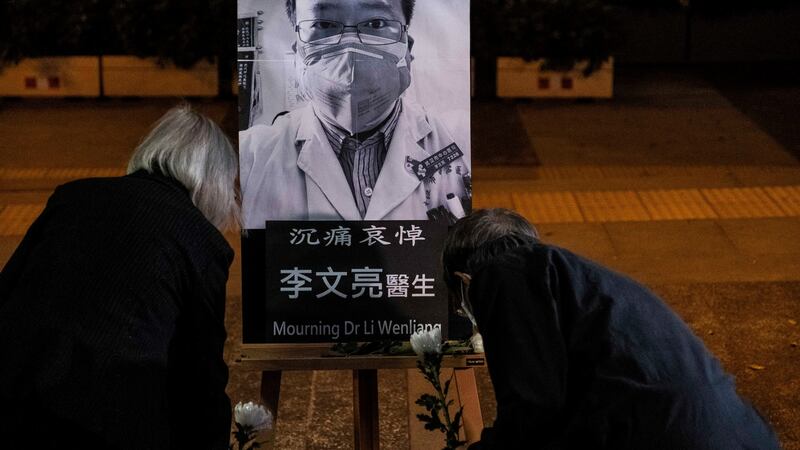 A vigil in Hong Kong on February 7th, 2020, for Dr Li Wenliang, the ophthalmologist at a Wuhan hospital who died from Covid-19. Li was reprimanded by the Chinese government for warning colleagues about the virus. Photograph: Lam Yik Fei/New York Times
