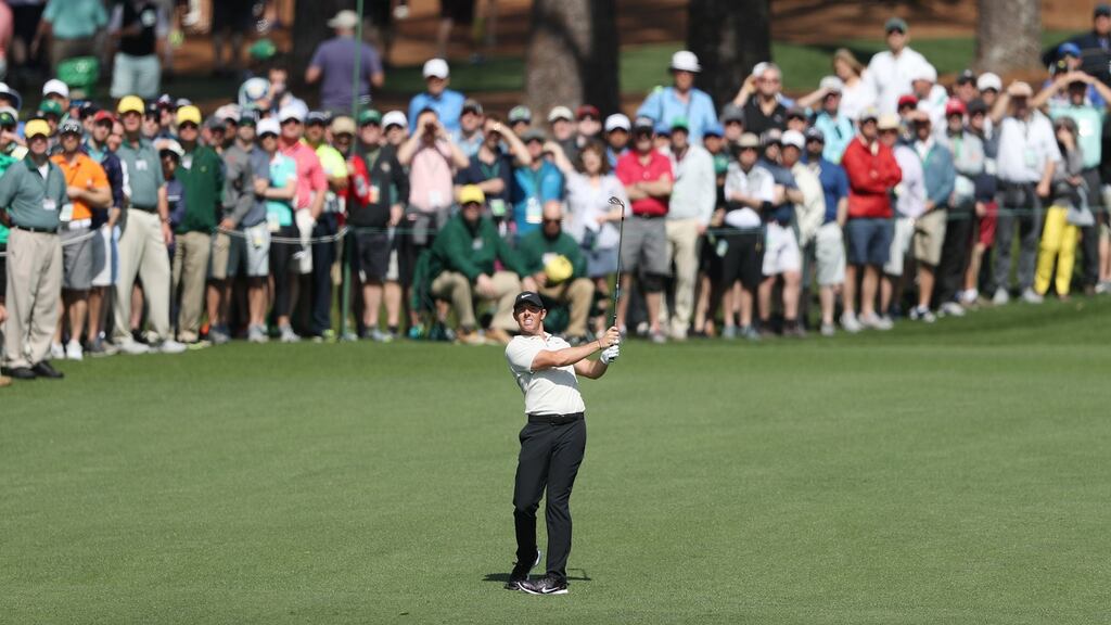 Rory McIlroy hits from the fairway on the second hole during the second round of the 2018 US Masters. Photo: Andrew Gombert/EPA
