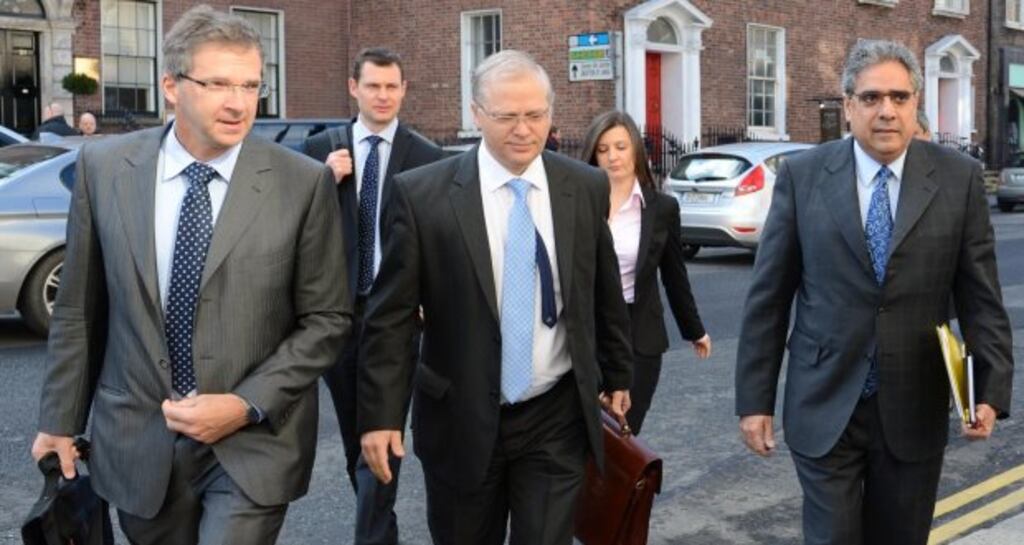 Members of the Troika arriving at Government Buildings in April 2012. Photograph: Dara Mac Dónaill