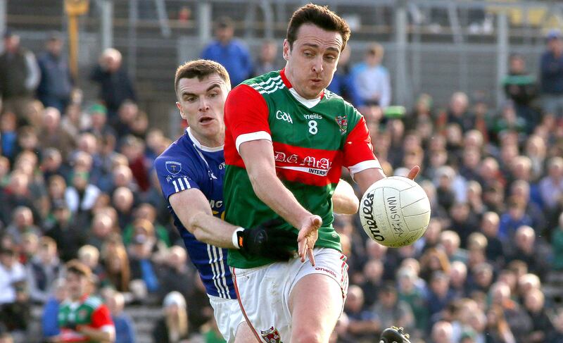Tommy Durnin of Inniskeen is tackled by Scotstown's Conor McCarthy in the Senior Football Championship Final. Photograph: Leah Scholes/Inpho