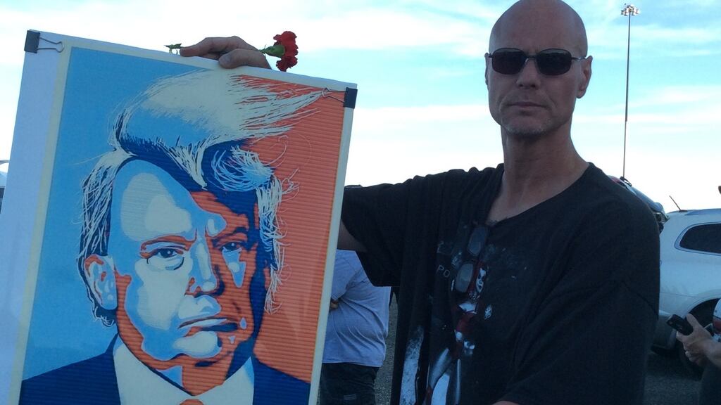 Brian Buckmaster (49), a worker at a elderly care home and a Republican voter in the 2008 and 2012 presidential elections, protesting outside Donald Trump’s campaign rally in Sacramento. Photograph: Simon Carswell