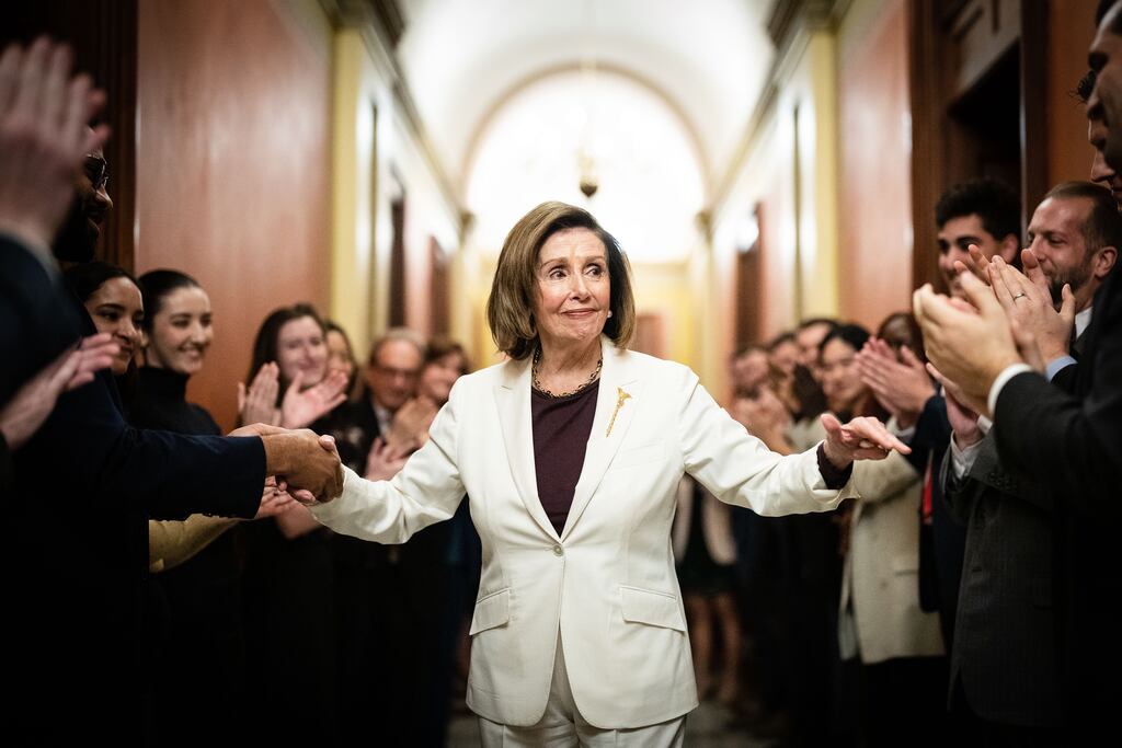 Nancy Pelosi is greeted by staff after she announced that she would step down from her leadership position, on Capitol Hill in Washington on Thursday. Photograph: Erin Schaff/New York Times