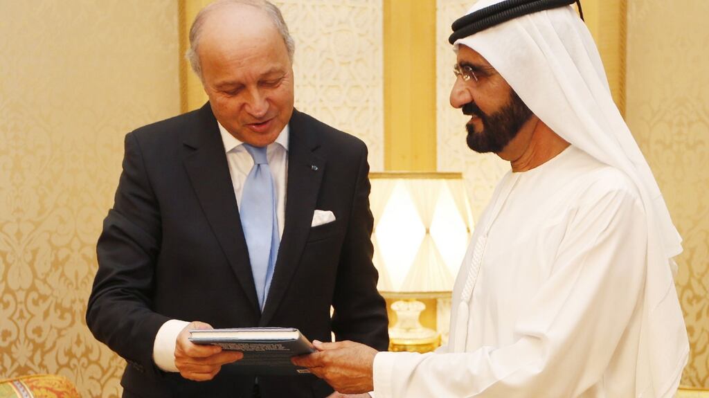 UAE vice president and prime minister, Sheikh Mohammed bin Rashid al-Maktoum with French foreign minister Laurent Fabius during their meeting at his palace in Dubai on Monday. Photograph: Karim Sahib/Getty Images