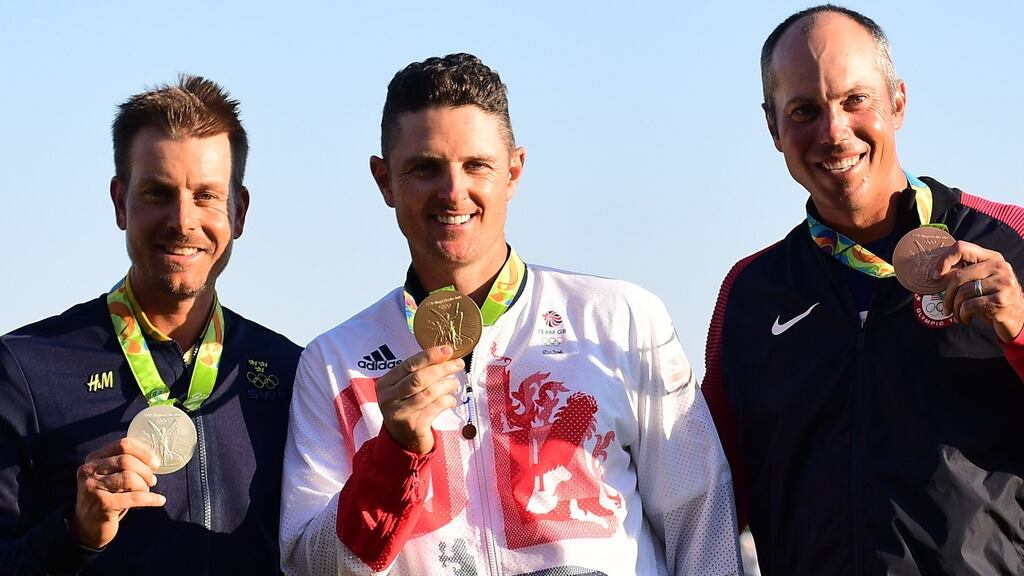 Sweden’s Henrik Stenson, Britain’s Justin Rose and USA’s Matt Kuchar pose with their medals in the men’s individual stroke play final day at the Olympic Golf course during the Rio 2016 Olympic Games in Rio de Janeiro. Photo: Getty Images