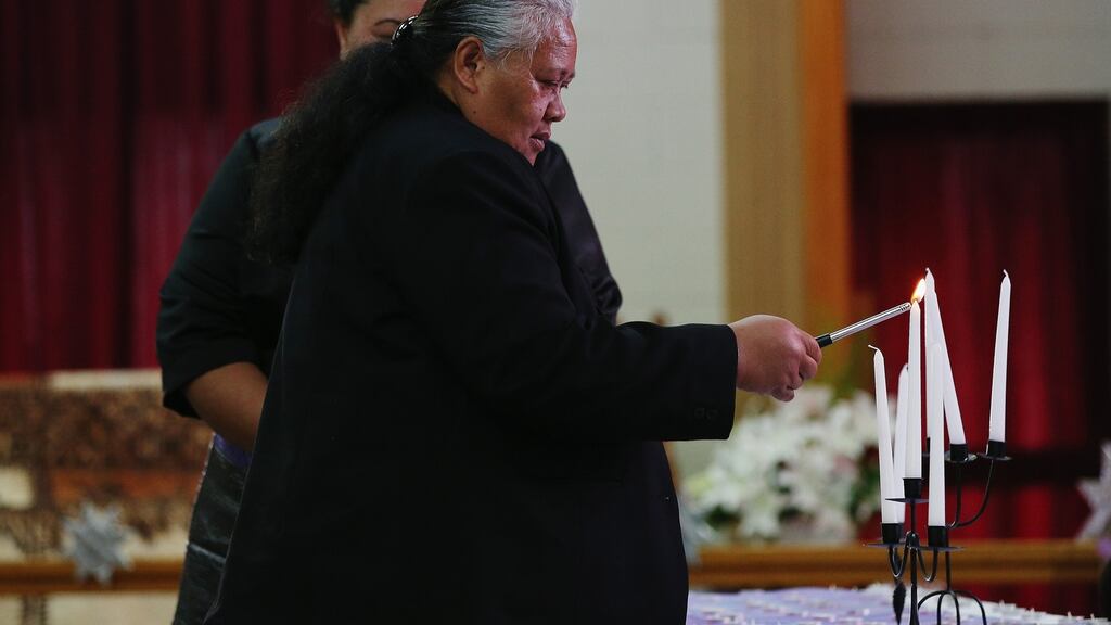 Jonah Lomu’s mother, Hepi Lomu, lights a candle during a public memorial service for her son at Lotofalei’a Tongan Methodist Church. Photograph: Getty