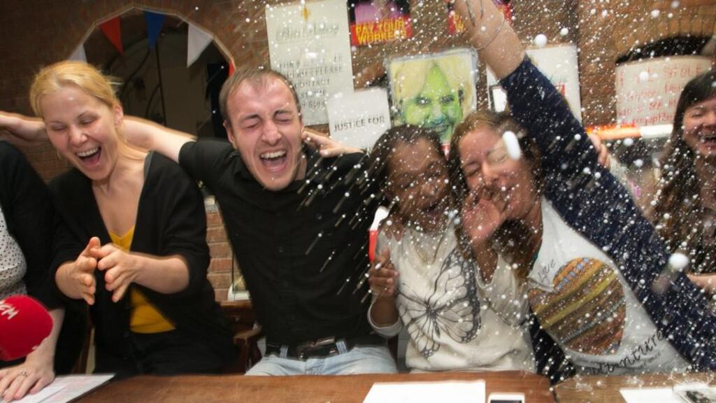 Paris Bakery workers Inna kovalska, Eduard Claihnet, Anissa Hosany and Matilde Naranjo get sprayed with champagne after ending their sit-in on its 19th day following official confirmation from Revenue that the company will be wound up at the Paris Bakery on Moore Street, Dublin. This will allow the workers to access the Insolvency Fund. Photograph: Gareth Chaney/Collins