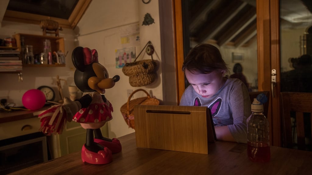 Coral Collier, who has a mental health condition, epilepsy, insomnia and mostly uses a wheelchair, spends most of her time with her iPad listening to music and watching cartoons. Photograph: Brenda Fitzsimons