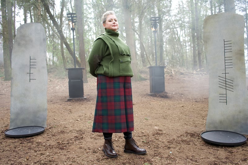 Siobhán McSweeney wearing a Stella McCartney jumper, tartan culottes (her own), Burlington socks, Loake boots and her own earrings