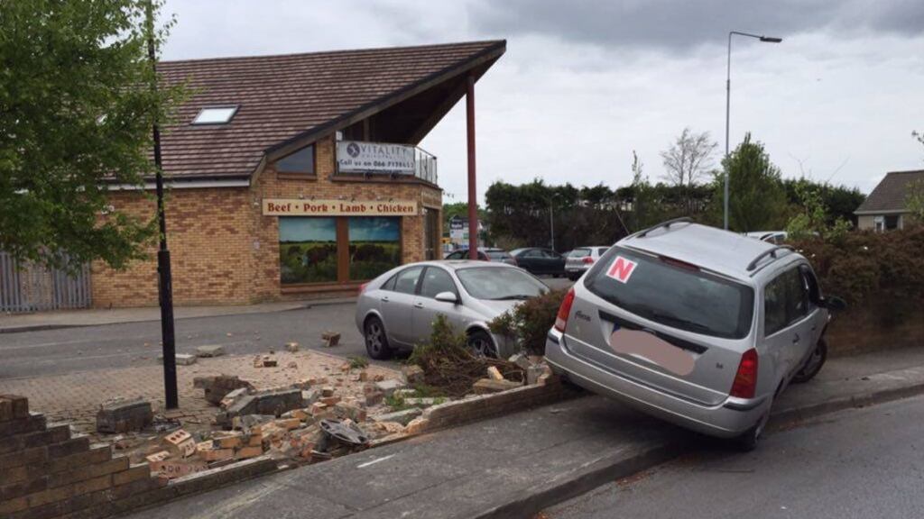 The car mounted the footpath and hit a wall. Photograph from Garda Síochána, Cork, Kerry & Limerick, Southern Region Facebook Page.