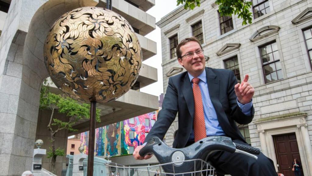 On yer bike: the IMF’s Peter Breuer leaves the Central Bank after his last day there. Photograph: Brenda Fitzsimons