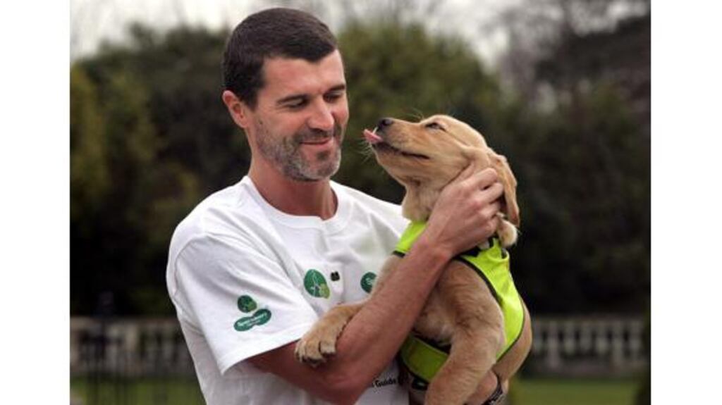 Sunderland manager Roy Keane with Neva, a three-month-old yellow
Labrador, at the launch of the Irish Guide Dogs for the Blind
Shades 2007 Campaign, in Dublin, yesterday.