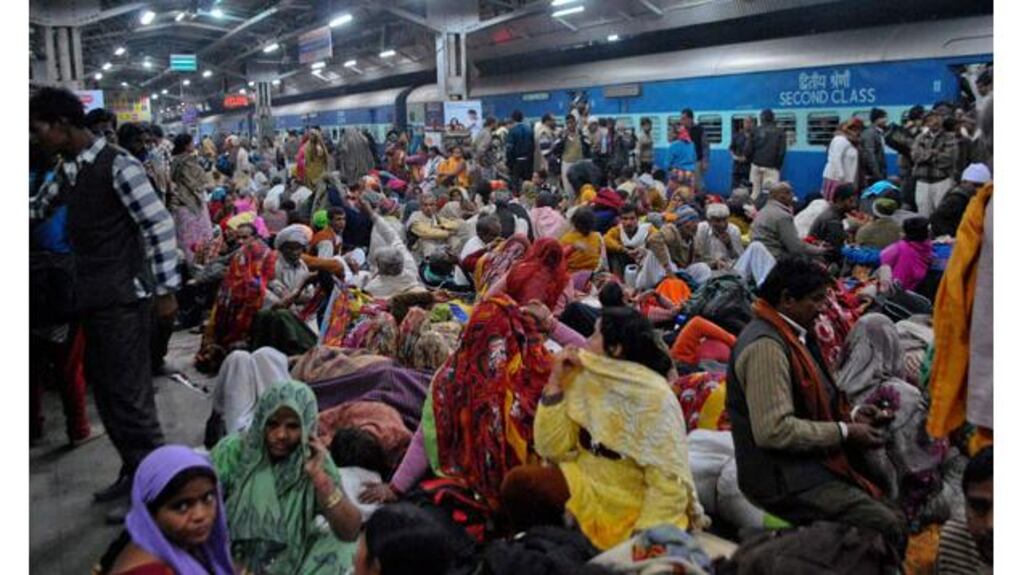 Passengers crowd together at a platform after part of a railing from a bridge collapsed at Allahabad railway station yesterday, killing 36 people. Photograph: Reuters