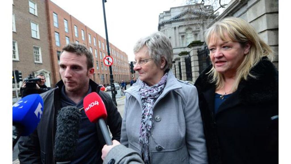 Steven O'Riordan, head of Magdalene Survivors Together, with Magdalene survivors Marina Gambold (centre) and Maureen Sullivan (right) speak to the media outside Leinster House on Monday afternoon. Photograph: Bryan O'Brien/The Irish Times