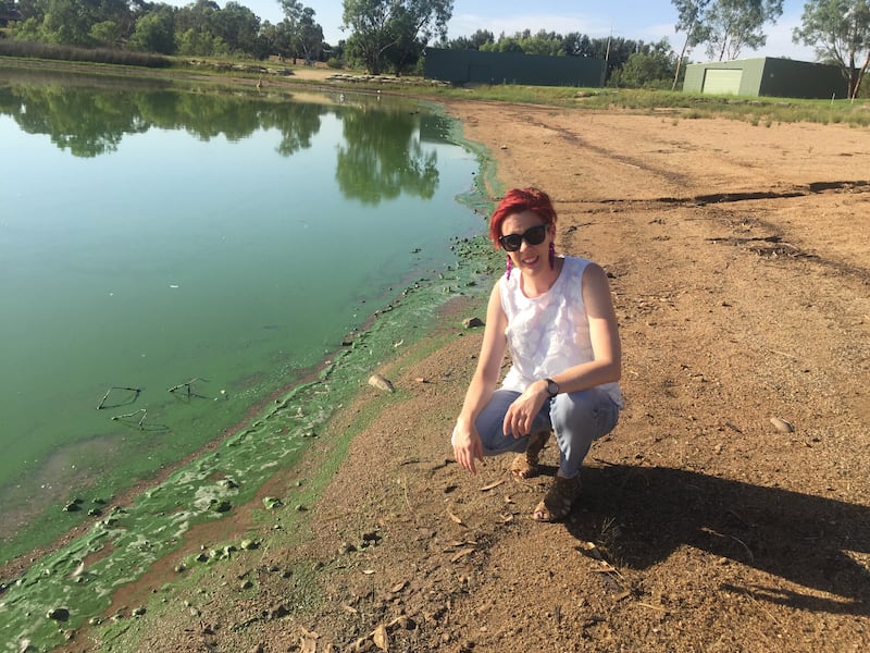 Wagga resident Kelly Shaw along the algae-ridden shore of Lake Albert.