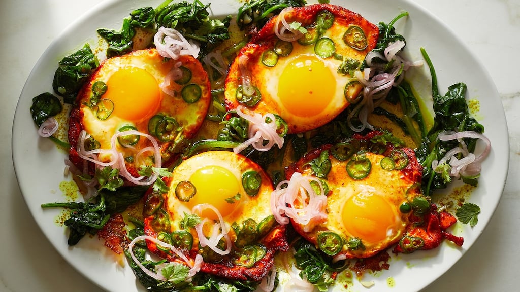 Turmeric fried eggs with tamarind and pickled shallots. Photographs: Christopher Simpson/The New York Times