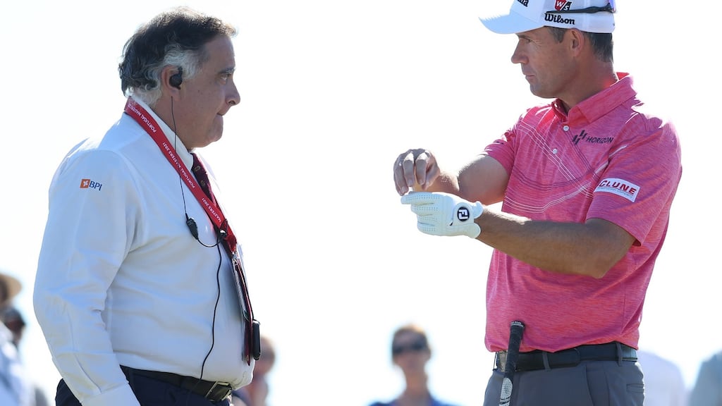 Padraig Harrington of Ireland talks with a Rules Official about an incident on the second green during Day Two of the Portugal Masters. Photograph: Warren Little/Getty Images