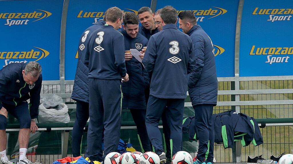 Martin O’Neill with Steve Guppy, Jeff Hendrick, Robbie Brady, Jonathan Walters, Robbie Keane and Roy Keane. Photograph: Inpho