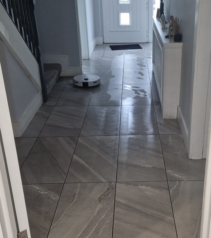 The Samsung Jet Bot Combo AI+ working in the hallway of Damian Cullen's home