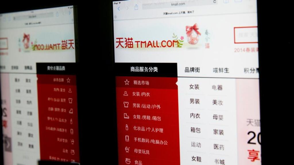 Tmall, a website of Alibaba Group , is reflected in a mirror as it is displayed on an Apple iPad . Photographer: Brent Lewin/Bloomberg