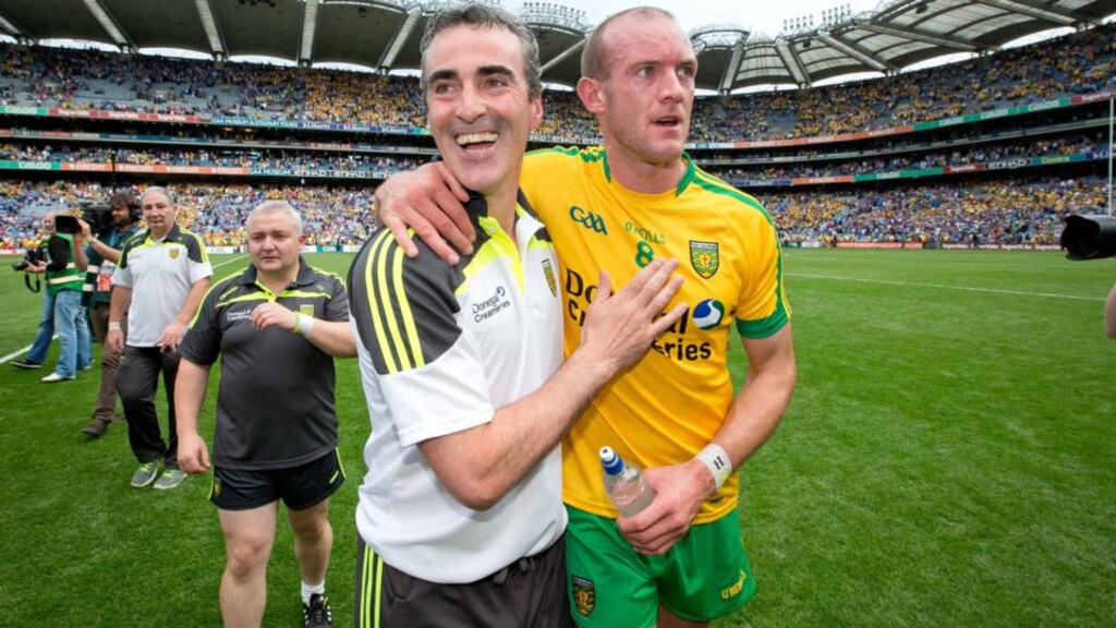 Donegal manager Jim McGuinness celebrates after the final whistle with Neil Gallagher following the Dublin win. photograph: inpho/morgan treacy