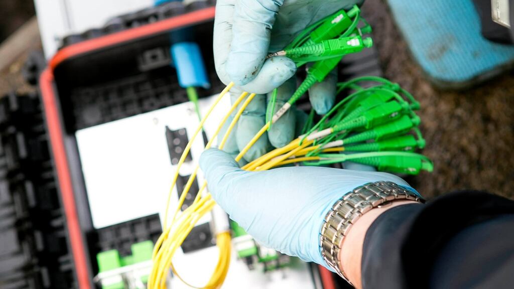 Technicians working on behalf of Eir install fast broadband to a home. Photograph: Karl Hussey/Fennell Photography