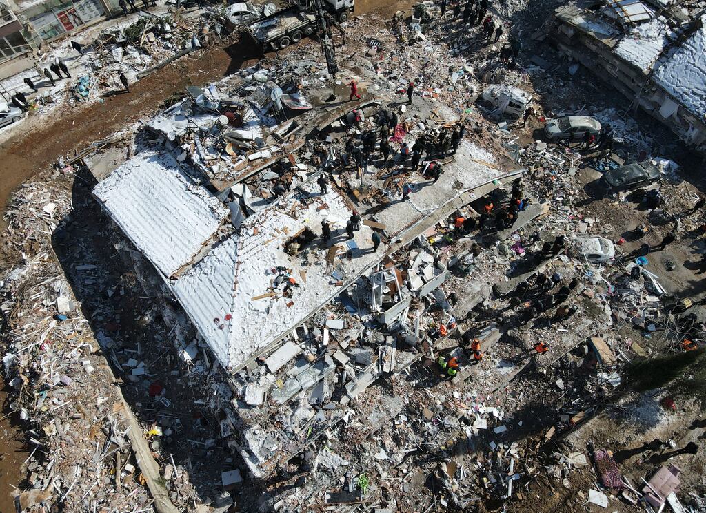 Rescue works continue their work at a collapsed building in the aftermath of a major earthquake in the Besni district of Adiyaman city, Turkey. Photograph: Necati Savas/EPA