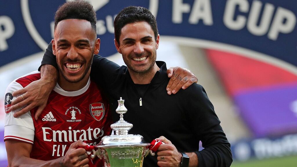 Arsenal’s two-goal hero Pierre-Emerick Aubameyang and head coach Mikel Arteta hold the FA Cup after the win over Chelsea at Wembley on Saturday. Photograph: Catherine Ivill/AFP/Getty Getty Images