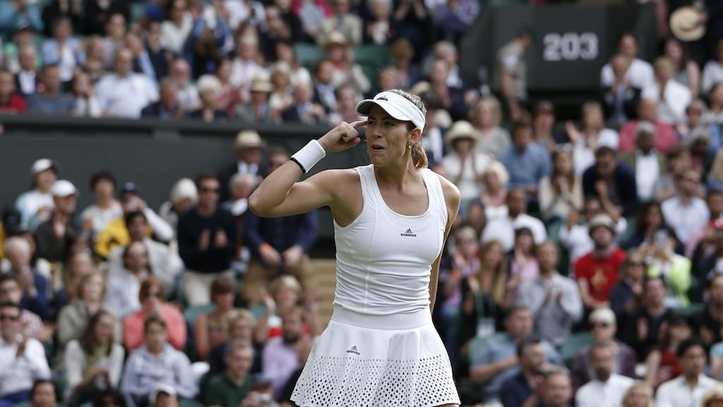 Spain’s Garbine Muguruza celebrates beating Italy’s Camila Giorgi in their women’s singles first round match on the first day of the 2016 Wimbledon Championships. Photo: Getty Images