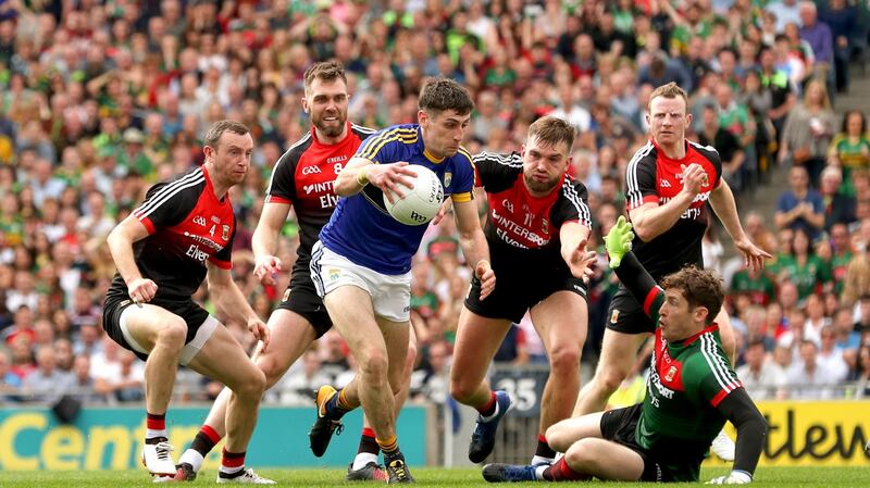 Kerry’s Paul Geaney eludes Mayo’s Keith Higgins, Séamus O’Shea, Aidan O’Shea, David Clarke and Colm Boyle. Photograph: James Crombie/Inpho