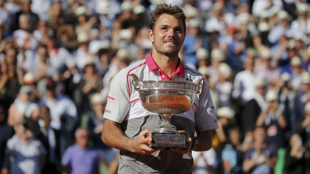 Stan Wawrinka of Switzerland poses with the trophy during the ceremony after winning the men’s final match against Novak Djokovic of Serbia at the French Open tennis tournament at the Roland Garros stadium in Paris Photo: Jean-Paul Pelissier/Reuters