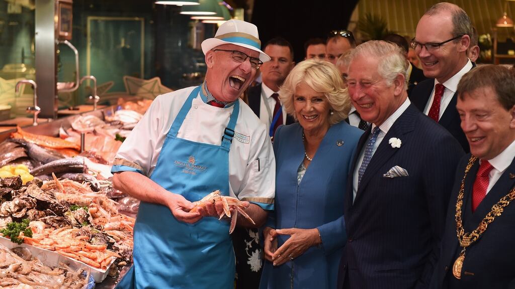 Prince Charles, Prince of Wales and Camilla, Duchess of Cornwall meet fishmonger Pat O’Connell as they visit the English Market. Photograph: Charles McQuillan/Getty Images.