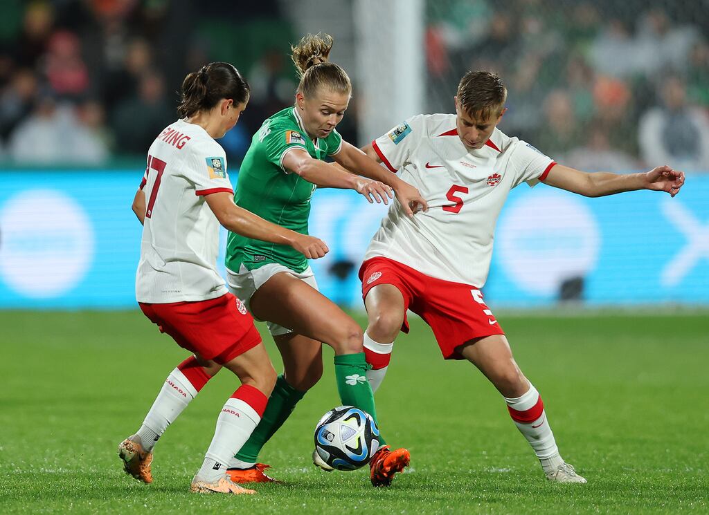 Ruesha Littlejohn of Republic of Ireland competes for the ball against Jessie Fleming and Quinn of Canada at Perth Rectangular Stadium on Tuesday. Photograph: Paul Kane/Getty Images